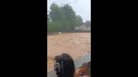 River swells and waters rage in San Mateo, Philippines due to Tropical Storm Yagi