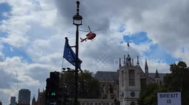 London Air Ambulance lands in Parliament Square following a traffic accident opposite the Houses of Parliament
