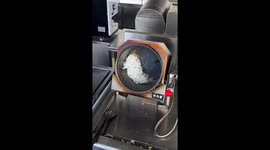 Awesome 'Robo Wok' invention serves up stir fries in China