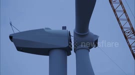 Engineers re-fit wind turbine blades in Kent docks, UK