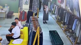 Mother falls on child after tripping over stool in clothes store