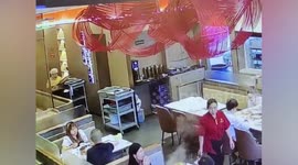 Student waiter accidentally tips boiling rice on own head after falling over