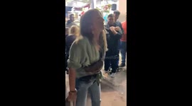 Lady fails to move punch boxing machine in Móstoles, Spain