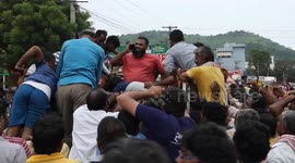 Boats and tractors used to navigate streets of Indian city ravaged by floods and power outages