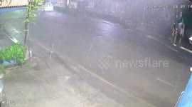 Sinkhole opens up in road as heavy rain falls in Thailand