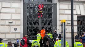 Police detain Greenpeace activists who scaled the Unilever HQ in London