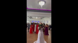 Boy proposes to his girlfriend during their mutual friend's wedding bouquet toss
