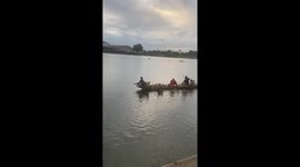 Pet dogs join Buddhist monk for a boat ride