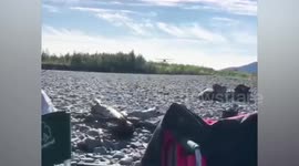 Russia: Pilot's Landing On Rocky Bank Just Feet From Holidaymakers