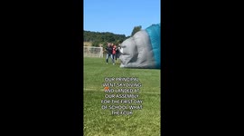 Principal makes dramatic entrance by skydiving into School assembly, video gets 10.8 million views