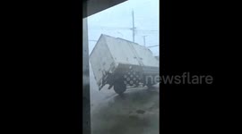 Locals scream as truck is overturned by strong winds as super typhoon hits southern China