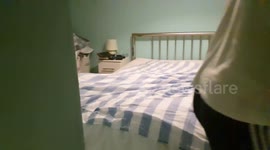 Bailey helping to make the bed