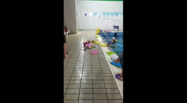 Teacher hurls boy into pool to join in swimming class