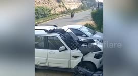Lorry tumbles down bank and lands on water tanker in India