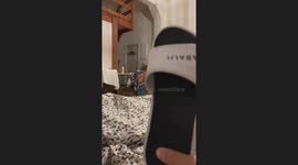 Person turns off lights with a slipper in Biarritz, France
