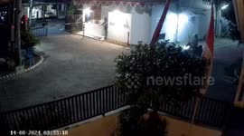 Motorcyclist falls during arrest for bird theft in Indonesia