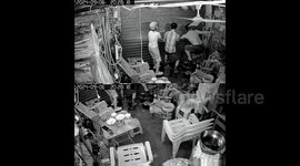 Staff desperately hold onto store's shutter before it's violently torn off by super typhoon winds in China