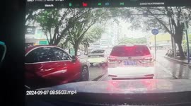 Speeding car slams into traffic at intersection causing several injuries in southern China