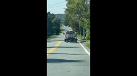 Pickup Tows Precarious Trailer