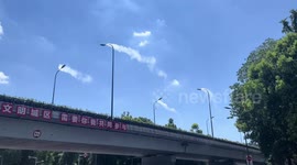 Streetlights give off steam during hot weather in China