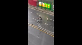 Mom and daughter struggle against typhoon winds in southern China