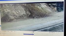 Coal truck overturned as huge landslide crashes onto road in north China