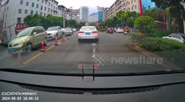 White car cuts off driver in Yunnan Province, China, causing accident
