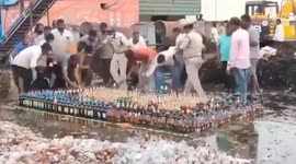 Locals steal bootleg liquour at police event for it to be bulldozed