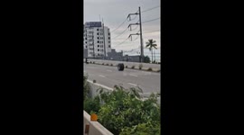 Ghost tyre rolls along beachfront road in Thailand