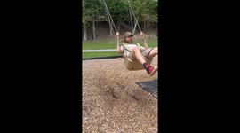 Man Falls Out of Swing