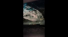 Incredibly Lucky Near Miss When Road Debris Crashes Through Windshield