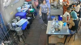 Youngsters play fighting accidentally knock over restaurant table