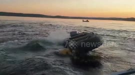 Russia: Rescuers 'Tame' Out-Of-Control Motorboat That Threw Two Fishermen Overboard