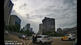 Careless driver accidentally knocked down traffic police after missing correct turning point in China