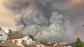 Smoke fills Dove Canyon due to rapidly spreading Airport Fire