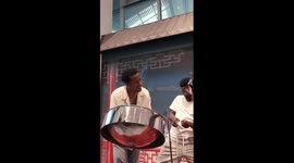 Caribbean steelpan player performs traditional Chinese song