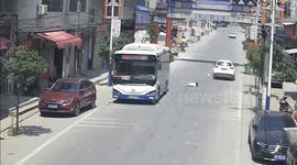 Sad moment Chinese child running into a car while rushing across street