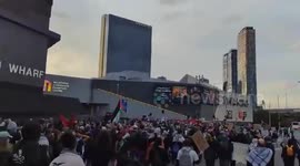Pro-Palestinian activists demonstrate against Land Forces at Melbourne Convention Centre