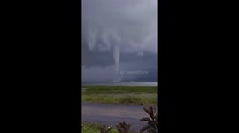 Waterspout tornado tears across lake in Indonesia