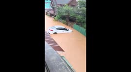 Car washed away by floods in northern Thailand