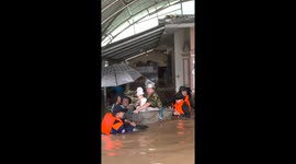 Rescue teams use tub to float baby and grandmother to safety during floods