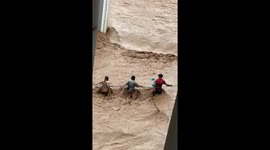 Stricken locals rag themselves through raging floods in Myanmar