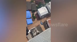 Helicopter drops supplies to residents stranded in Thailand floods