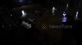 Thai Navy SEALs float baby across flood using basin