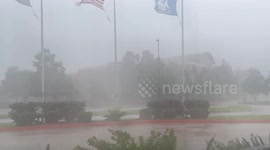 American flag flies in the strong winds of Hurricane Francine