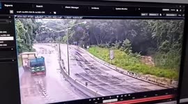 Truck wobbles from side-to-side as it loses control on slippery downhill road