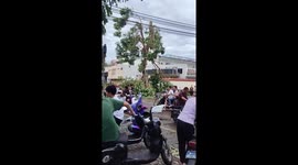 Neighbours crowd round generator to charge their smartphones in China