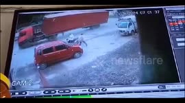Speeding Container Overturns at Busy Intersection, people standing near the car narrowly escaped