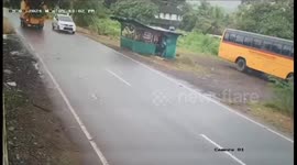 Scooter rider leaps away at last moment to avoid crash with oncoming car