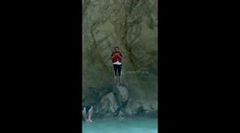 Person slips on rocks at Noori Waterfall, Pakistan